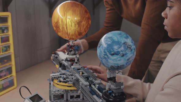 Working On Science Project With Teacher alt