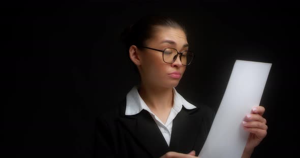 Business Woman is Outraged By Document She Has Read Crumples Sheets of Paper