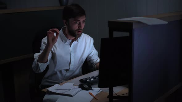 Photo of Focused Brunette Guy in Office Wear Analyzing Data Doing Work Using Desktop Pc and alt
