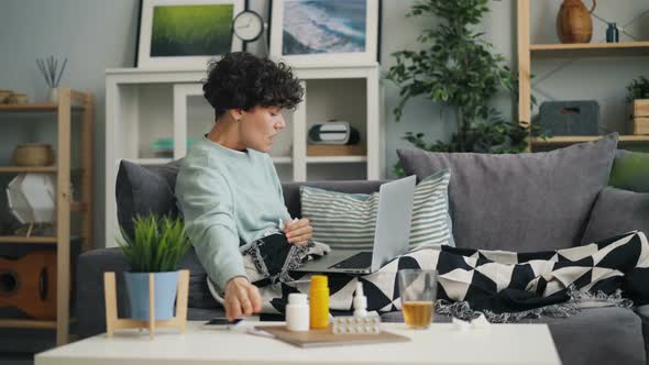 Coughing Student Talking To Doctor Online Using Laptop Showing Pills Thermometer alt