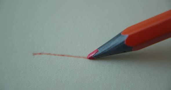 Graphite Orange Color Pencil Draws a Straight Line on a White Background Paper Special Paper for the alt