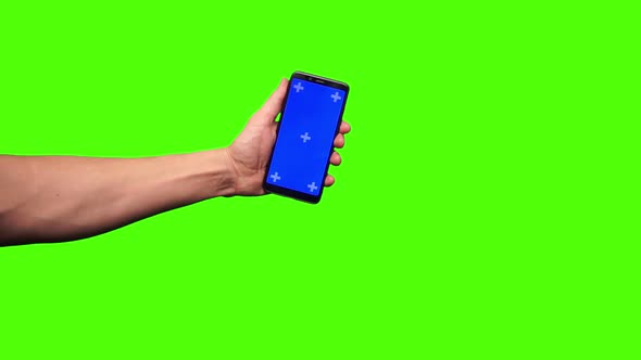 Smartphone in hand on a Greenscreen alt