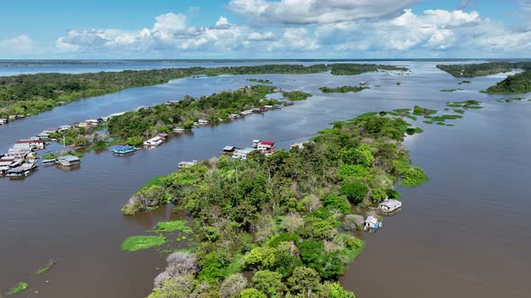 Famous Meeting of the Waters tourism landmark at Manaus Brazil. alt