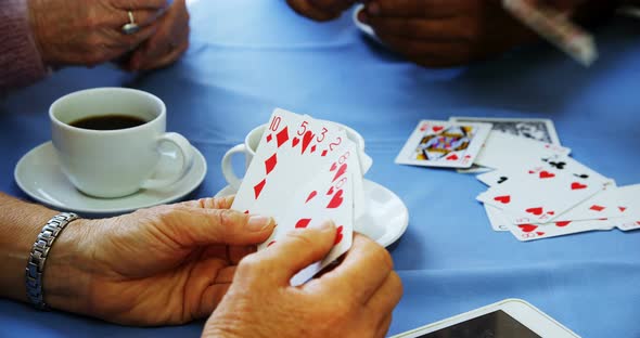 Senior friends playing cards at nursing home 4k