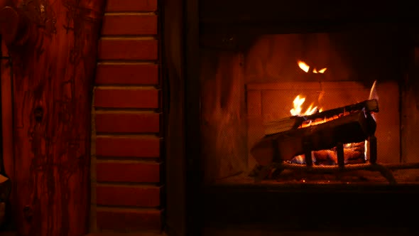 Fire in Brick Fireplace Firewood Burning Wood Blazing in Cozy Lodge or Cabin
