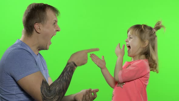Father and Little Daughter Playing Rock Paper Scissors. Chroma Key. Leisure Game alt