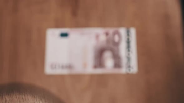 10 Euro Under Magnifying Glass alt