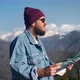 Attractive Traveller Man Hiker with Backpack Checking Map to Find Direction in the Mountains - VideoHive Item for Sale