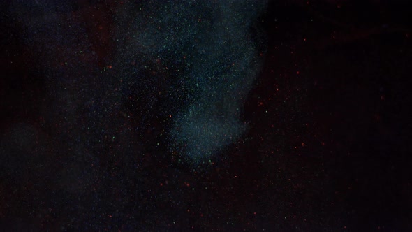 Mixing of Particles of Luminous Colors of Blue and Red Paint in a Light Haze Smoke alt