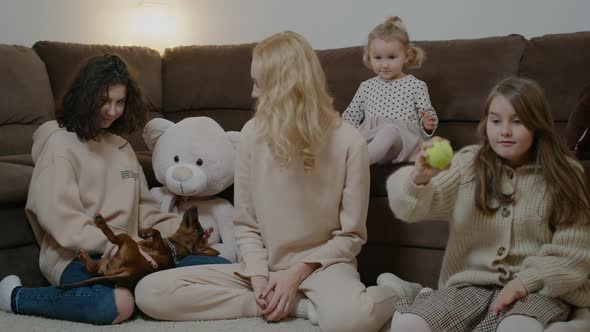 Mom with Cute Kids Girls Play with Dog Stroke Pet and Throw Toy alt
