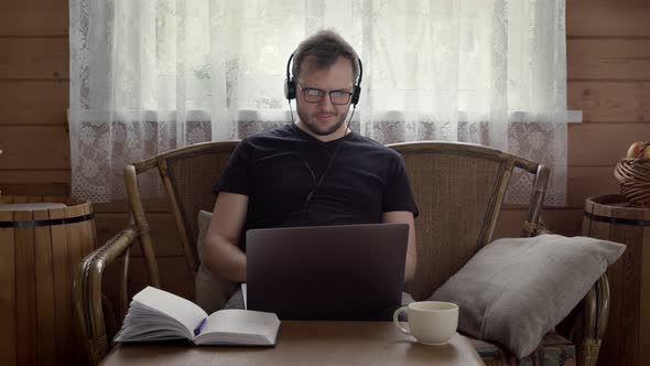 Handsome Smiling Freelancer Works Remotely, Man Studying Online, Surfing Net alt