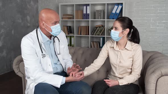 Male Nurse Doctor Hold Hand of Young Woman Patient Help Express Empathy Encourage Tell Diagnosis at alt