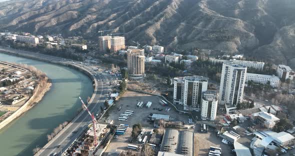 Aerial view of Ortachala district at sunset. cityscape over Kura river in Tbilisi, Georgia 2022 alt