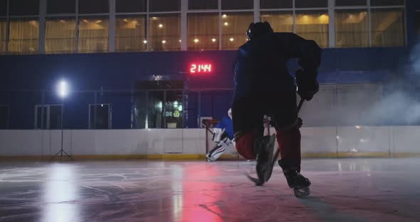 Professional Hockey Player Attacks the Gate and Strikes, but the Goalkeeper Beats the Puck. A Goal alt