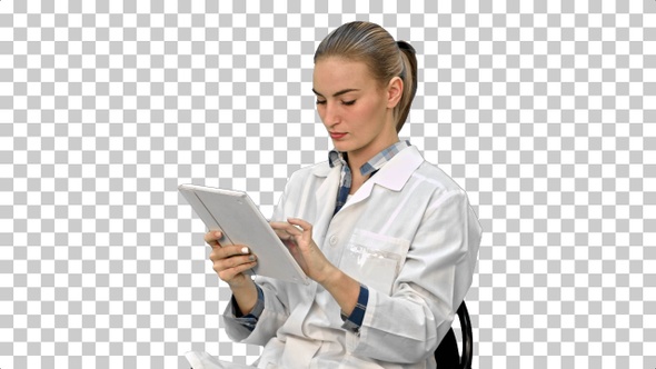 Female doctor working on digital tablet, Alpha Channel