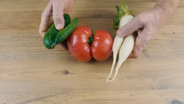 Man Puts on the Table Ugly Vegetables