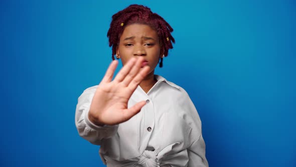 Dissatisfied Afro American Woman Showing Her Refusal Denies Something Against Blue Background