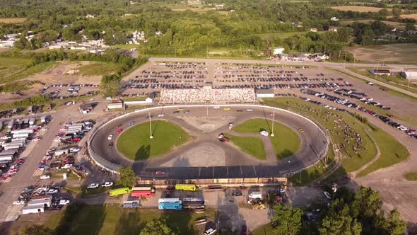 Racing Stock Cars Speeding Around The Circuit At Flat Rock Speedway In Monroe County, Michigan. aeri alt