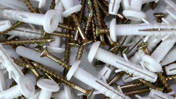 Bunch of Tapping Construction Screws with Plastic Dowels for Fixture Rotate Clockwise alt