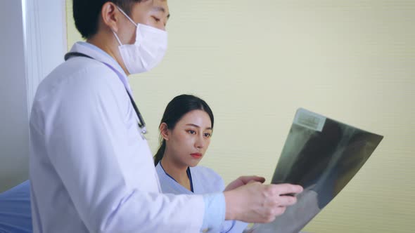 Doctor Checking Patients Xray alt