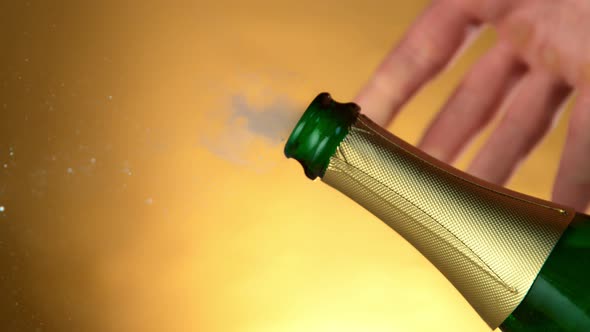 Super Slow Motion Shot of Champagne Explosion on Golden Luxury Background at 1000Fps alt