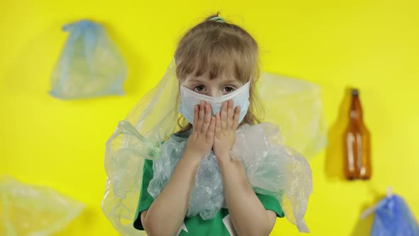 Girl Activist Free Up From Plastic Packages on Her Neck and Head. Plastic Pollution. Save Ecology alt