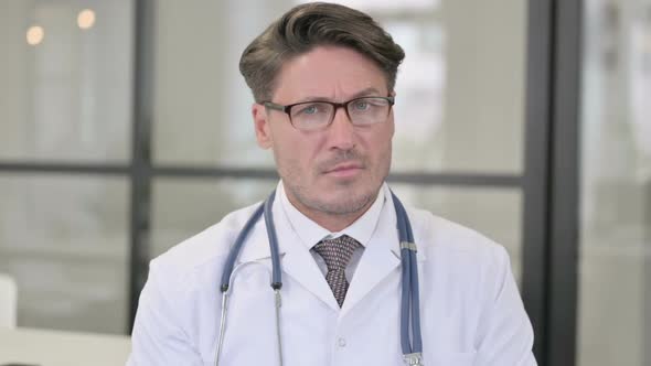 Portrait of Doctor Showing No Sign by Head Shake alt