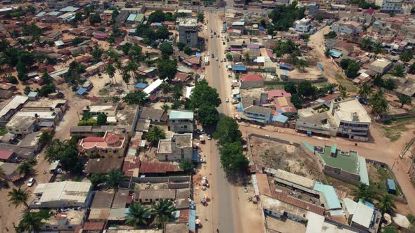 CInematic Aerial View of african city neighborhood roads with Traffic, Lomé, Africa alt