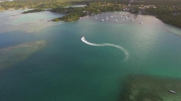 Flying Over Motor Boat Sailing in Bay, Mauritius Island alt