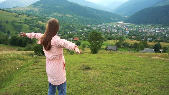 Happy Woman Traveler Enjoying of Mountain View