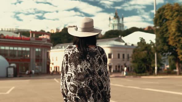 Unrecognizable Woman in Town alt