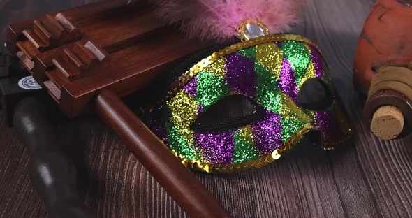 Purim Holiday with Cookies Hamans Ears in Bucket Carnival Mask Over Rustic Background alt