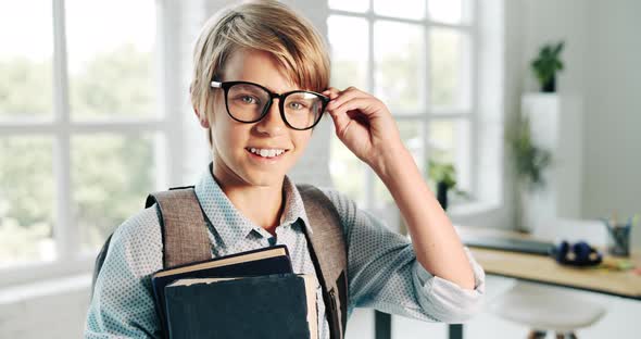 Boy with English Book in Eyeglasses