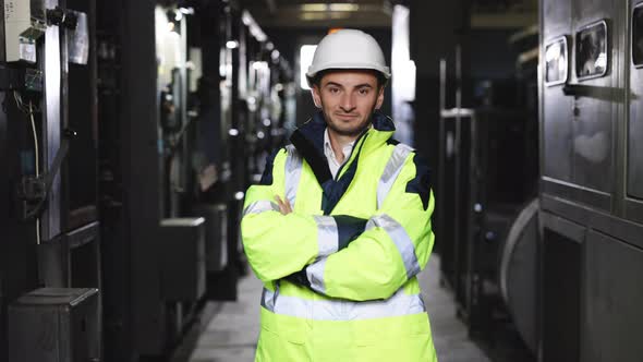 Zoom Portrait of Caucasian Heavy Industry Electricity Worker Smiling Confident for Camera