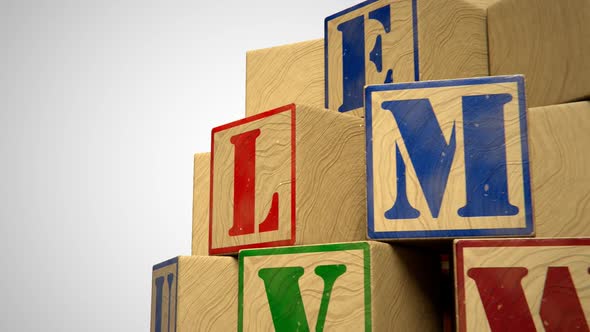 Blocks with colorful letters. Toys used to teach children spelling and writing. alt