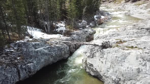 Aerial Footage Creek Flows Eroding Rocks Over Time