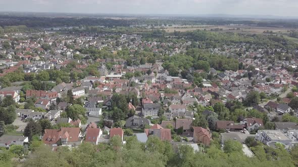 Aerial view of german suburb near Mainz. Private houses, rooftops, trees, sky, summer Germany