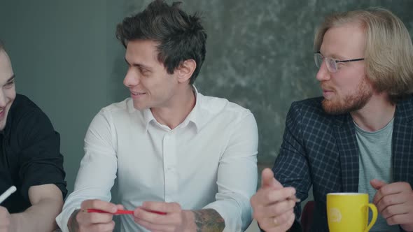 Colleagues at the Negotiating Table. Teamwork Creative Team alt