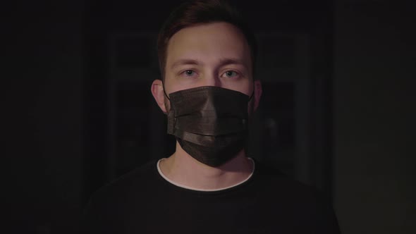 Pandemic portrait of a young man wearing protective mask