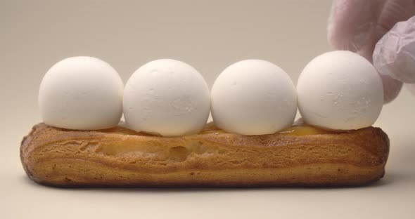 Confectioner Adds Cream Cheese Balls To the Eclair, Making Dessert with Mascarpone, Sweet Choux alt