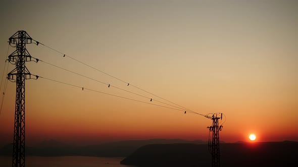 High Voltage Towers at Sunset. Timelapse
