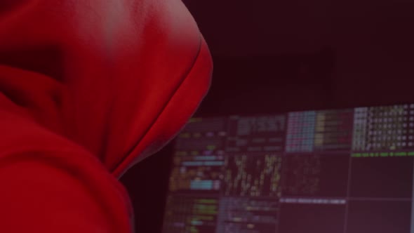 Anonymous Person in a White Mask Works on the Computer Inputs Code Types Very Fast on the Keyboard alt