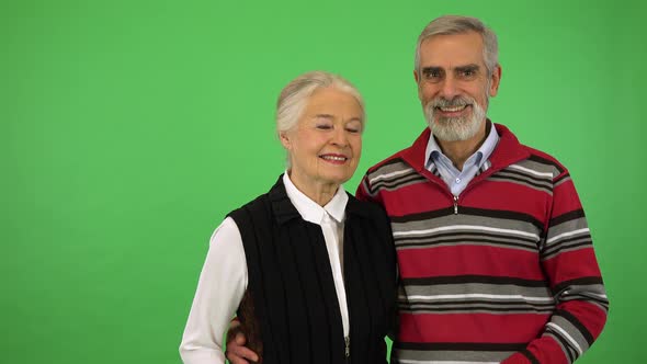 An Elderly Couple Smiles at the Camera - Green Screen Studio alt