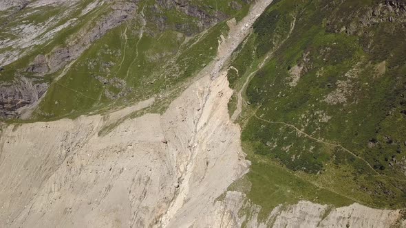 Aerial shot of big cranck from climate change and permafrost in the swiss alps alt