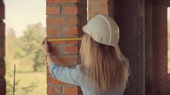 Designer On Construction Site. Civil Engineer Measurement Construction. Real Estate Building Project alt