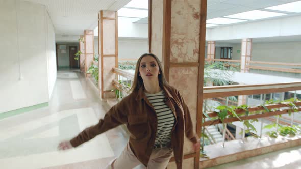 Young Woman Is Dancing In Empty Hall