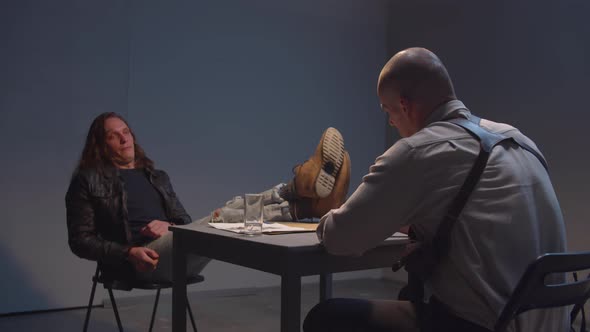 The Criminal Lays His Feet on the Table alt