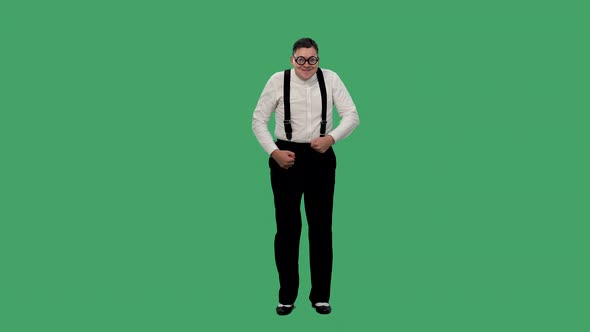 Portrait of a Shy Man Dancing on a Green Screen alt