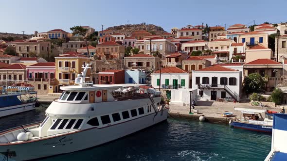 Rhodes, Greece: Pan shot from Emboria harbour of traditional beautiful multicolored houses  alt