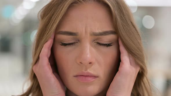 Close Up of Face of Woman Having Headache alt